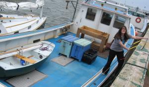 Victoria clambering on boats to dock 