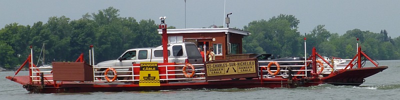 Cable Ferry crossing the river. Cable just below surface!